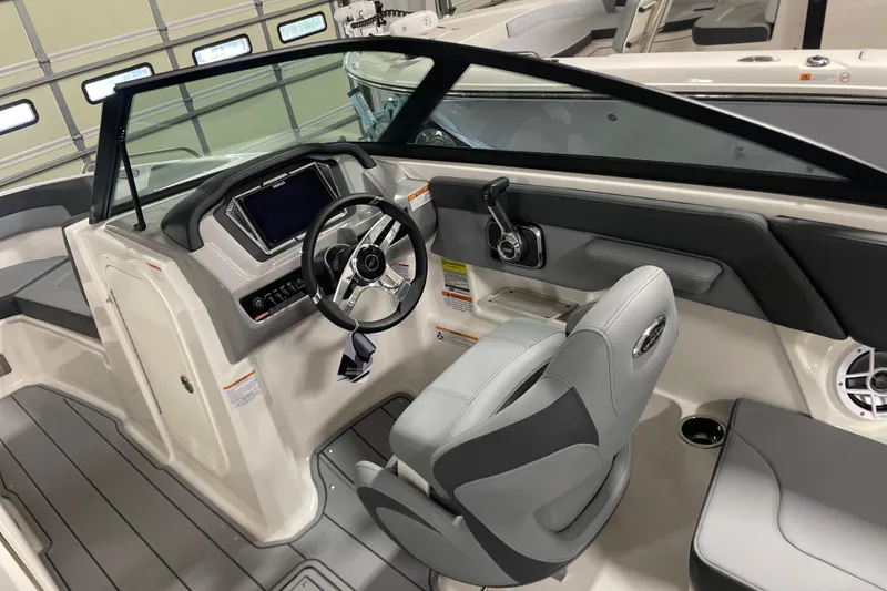 Slide: The Image of 2026 Chaparral 23 SSi boat interior with modern dashboard and seating. - 5