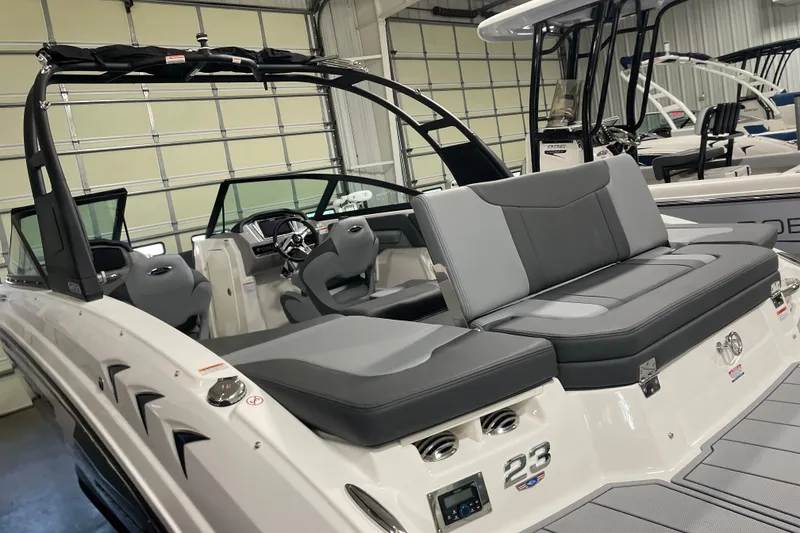 Slide: The Image of 2026 Chaparral 23 SSi boat interior with sleek seating and modern dashboard. - 8