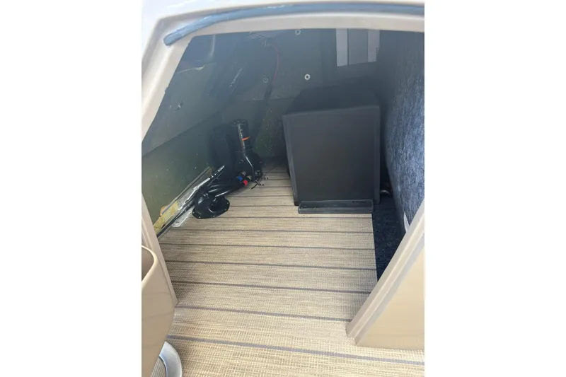 Slide: The Image of Interior storage space of 2019 Bennington 25 QSBA boat with equipment. - 3