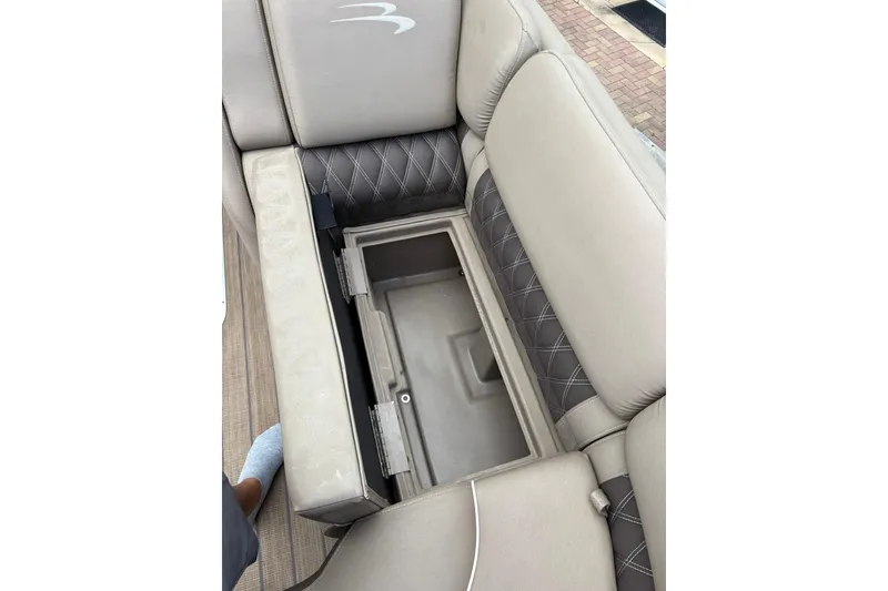 Slide: The Image of 2019 Bennington 25 QSBA boat seat with open storage compartment. - 6