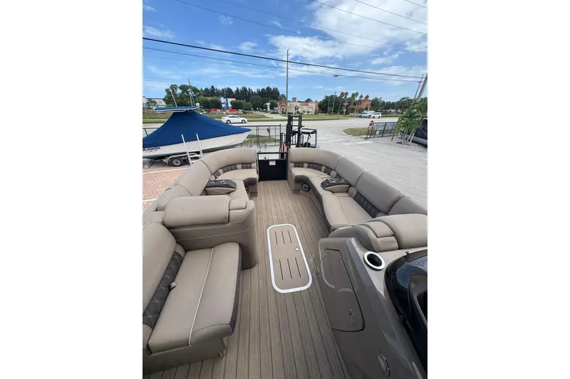 Slide: The Image of Spacious interior of 2019 Bennington 25 QSBA pontoon boat with plush seating. - 8