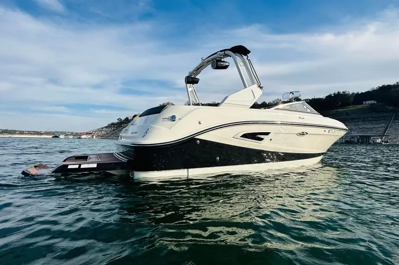 Slide: The Image of 2017 Sea Ray SLX-W 230 boat on calm water, scenic background. - 3