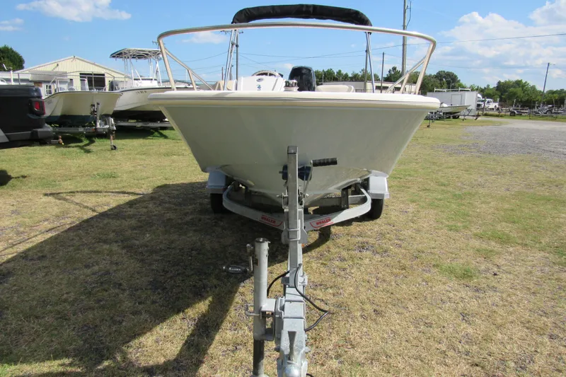 Slide: The Image of Rear view of a 2021 Boston Whaler 130 Super Sport boat with outboard motor. - 5