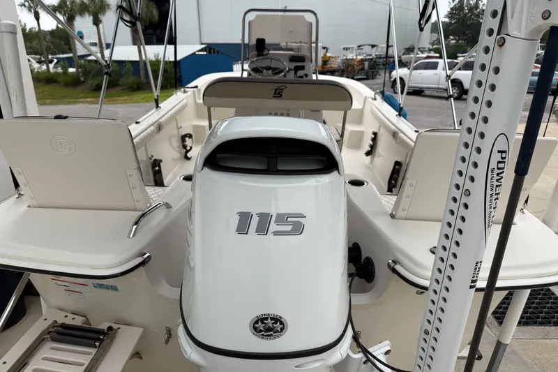 Slide: The Image of 2022 Carolina Skiff 17 LS boat with 115 horsepower engine, docked outdoors. - 6