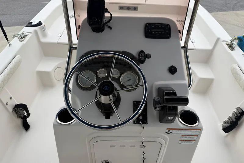 Slide: The Image of 2022 Carolina Skiff 17 LS boat console with steering wheel and controls. - 7