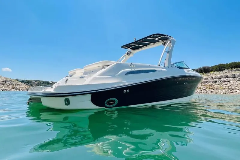 Slide: The Image of 2008 Sea Ray 250 SLX boat on clear turquoise water under a bright blue sky. - 4