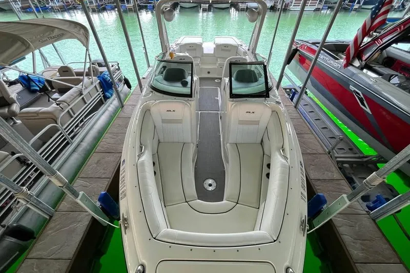 Slide: The Image of 2008 Sea Ray 250 SLX boat docked, featuring spacious seating and sleek design. - 5