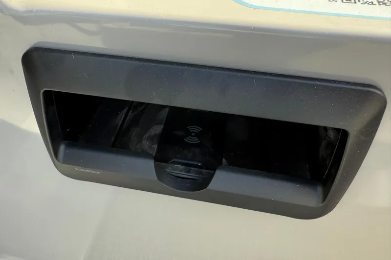 Slide: The Image of Close-up of a 2025 Bentley Pontoons Legacy 243 Navigator charging port. - 10