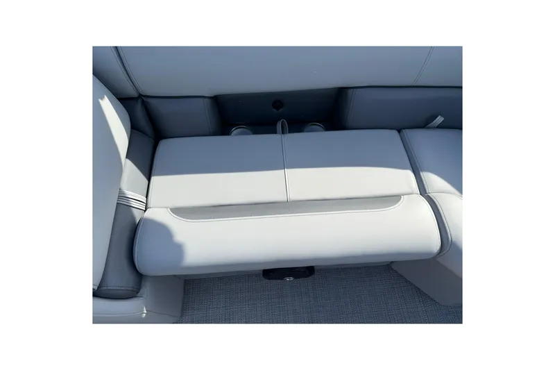 Slide: The Image of 2025 Bentley Pontoons Legacy 243 Navigator interior seating detail, featuring sleek gray upholstery. - 12
