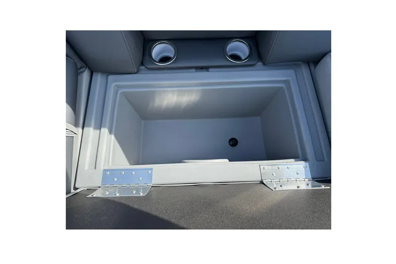 Slide: The Image of 2025 Bentley Pontoons Legacy 243 Navigator storage compartment with cup holders. - 14