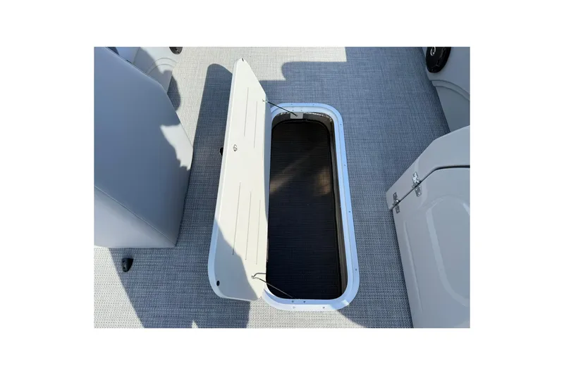 Slide: The Image of 2025 Bentley Pontoons Legacy 243 Navigator storage compartment, open on deck. - 16