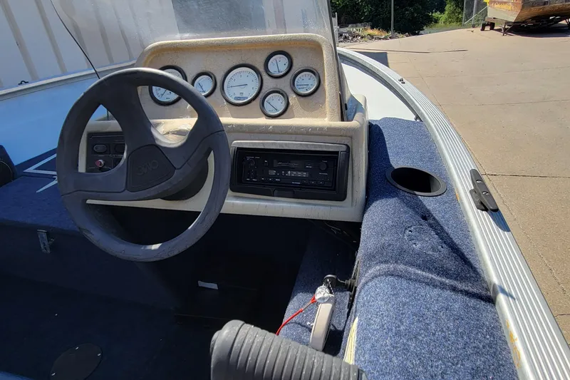 Slide: The Image of Outboard motor of a 1997 Sea Nymph 168 DLX on concrete surface. - 10