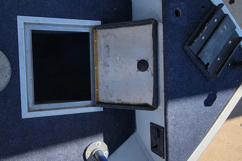 Slide: The Image of Interior view of a 1997 Sea Nymph 168 DLX boat storage compartment. - 18