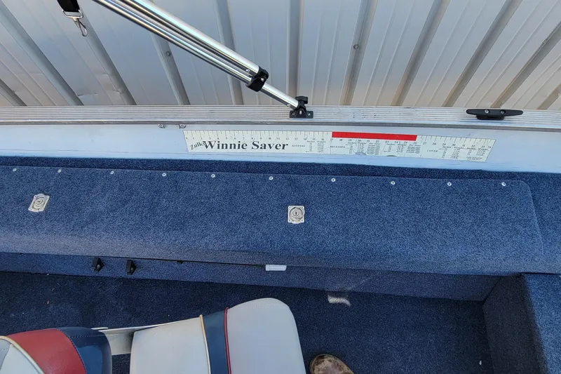 Slide: The Image of 1997 Sea Nymph 168 DLX boat interior with measuring ruler and blue carpet. - 23