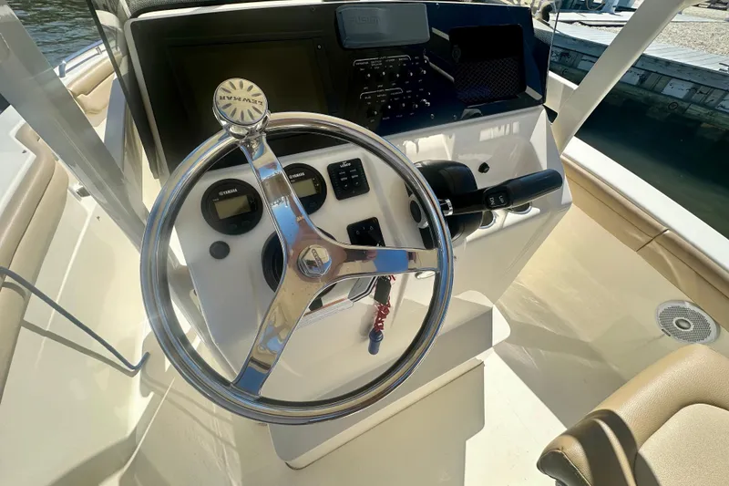 Slide: The Image of 2020 Scout 215 XSF boat steering console with Yamaha controls and gauges. - 3