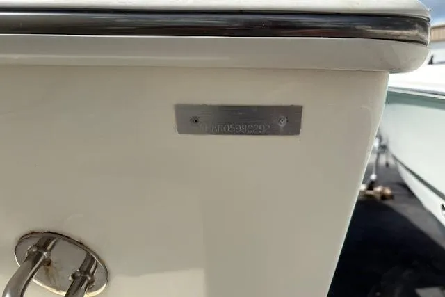 Slide: The Image of 1992 Mako 261B boat hull with identification plate, close-up view. - 13