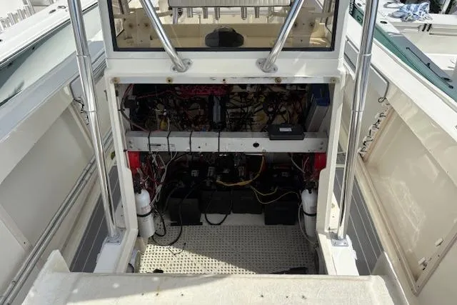 Slide: The Image of 1992 Mako 261B boat interior showing wiring and equipment setup. - 21