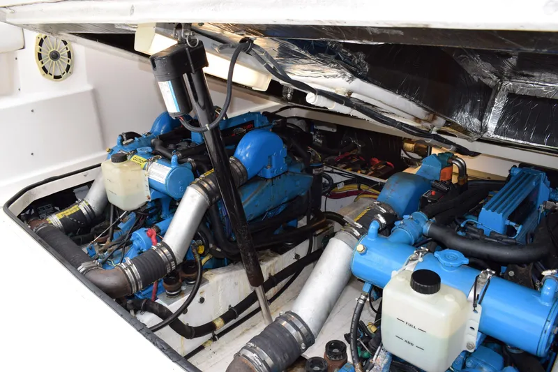 Slide: The Image of Engine compartment of a 2002 Tiara 2900 Coronet with dual blue marine engines. - 24