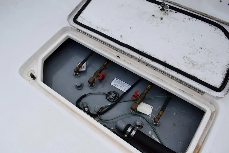 Slide: The Image of Open hatch of 2002 Tiara 2900 Coronet showing internal components and wiring. - 25