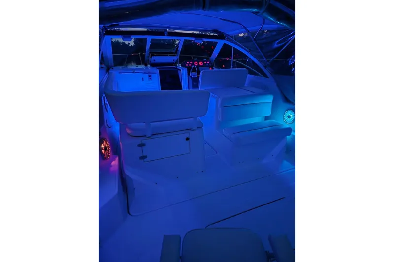 Slide: The Image of Interior of 2002 Tiara 2900 Coronet boat with blue ambient lighting. - 30