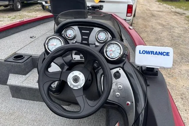 Slide: The Image of 2023 Tracker Pro Team 175 TXW boat dashboard with steering wheel and Lowrance device. - 12