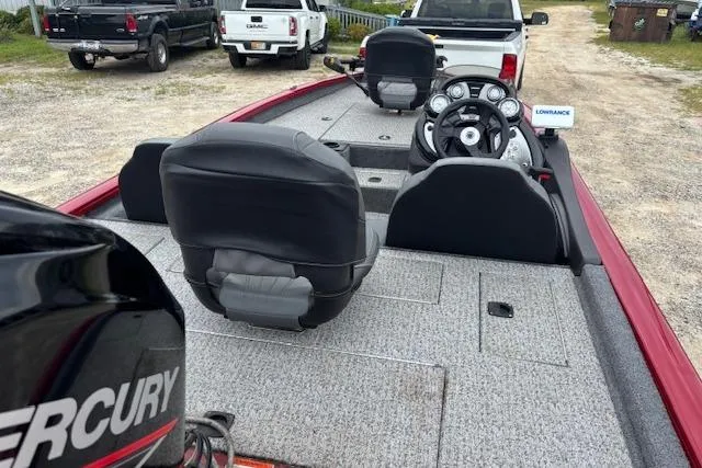 Slide: The Image of 2023 Tracker Pro Team 175 TXW boat interior with steering wheel and seating. - 15