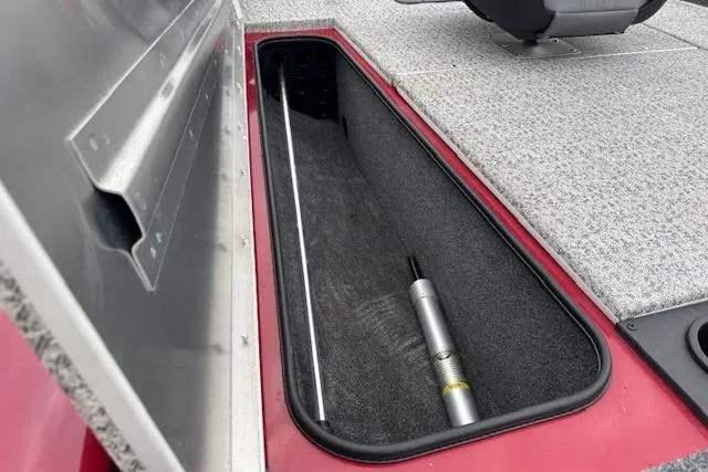 Slide: The Image of 2023 Tracker Pro Team 175 TXW boat storage compartment with carpeted interior and hydraulic support. - 18