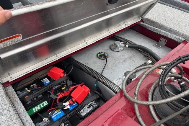 Slide: The Image of 2023 Tracker Pro Team 175 TXW boat battery compartment with wiring and components. - 19