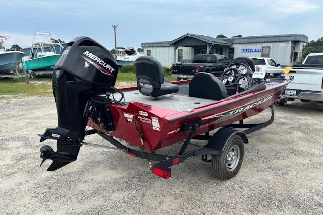 Slide: The Image of 2023 Tracker Pro Team 175 TXW boat with Mercury engine on a trailer. - 2