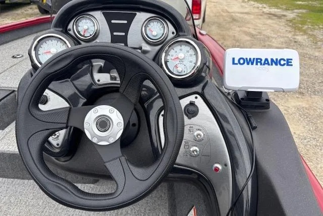Slide: The Image of 2023 Tracker Pro Team 175 TXW dashboard with steering wheel and Lowrance fish finder. - 21