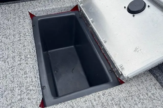 Slide: The Image of 2023 Tracker Pro Team 175 TXW storage compartment with open lid, showcasing interior space. - 22