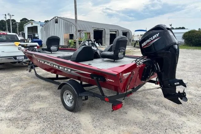 Slide: The Image of 2023 Tracker Pro Team 175 TXW boat with Mercury engine, parked on a trailer. - 4