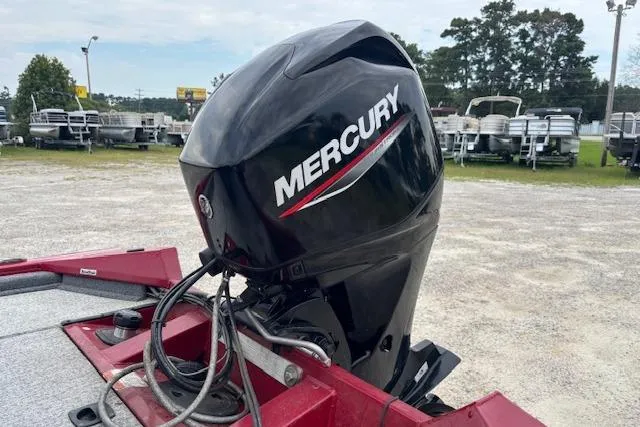 Slide: The Image of 2023 Tracker Pro Team 175 TXW with Mercury outboard motor in a boatyard. - 9