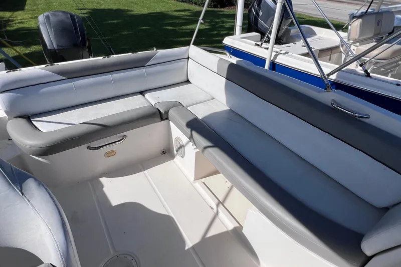 Slide: The Image of 2018 Bayliner 210 Deck Boat interior with spacious seating and modern design. - 10