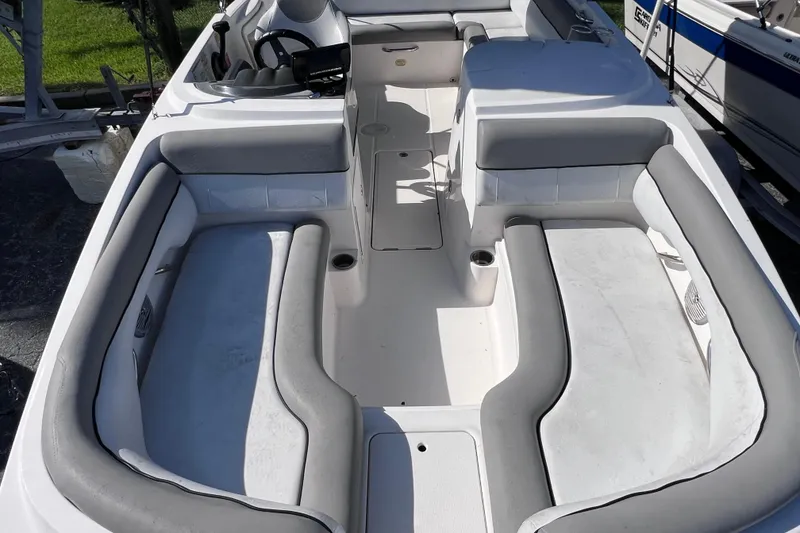 Slide: The Image of 2018 Bayliner 210 Deck Boat interior with spacious seating and modern design. - 17