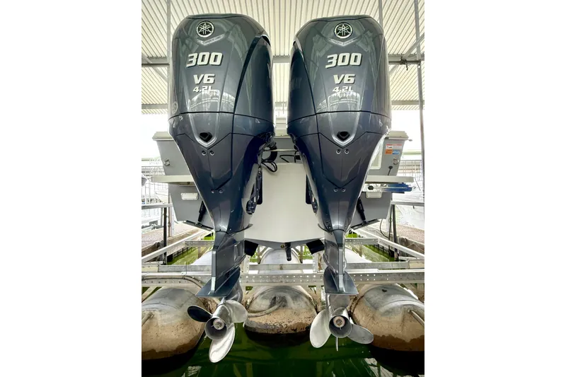 Slide: The Image of Twin Yamaha 300 V6 outboard engines on a 2023 Parker 2820 XLD Sport Cabin boat. - 13