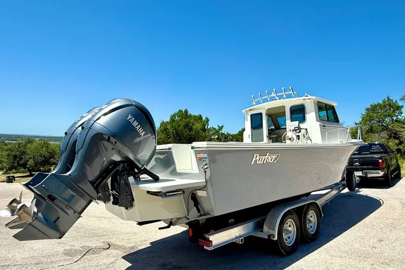 Slide: The Image of 2023 Parker 2820 XLD Sport Cabin boat with Yamaha engine on trailer. - 20