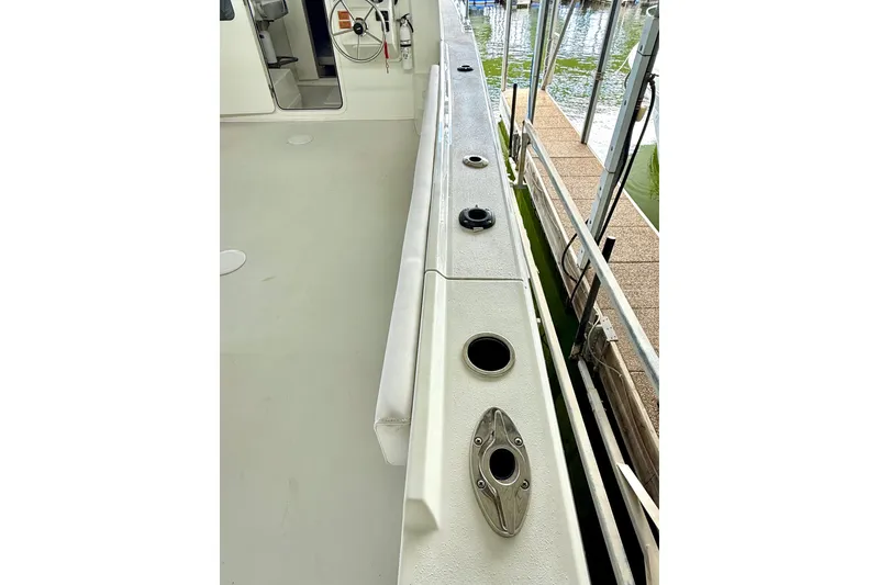 Slide: The Image of 2023 Parker 2820 XLD Sport Cabin boat deck with rod holders and clean design. - 26