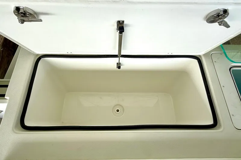 Slide: The Image of Open storage compartment in 2023 Parker 2820 XLD Sport Cabin boat. - 29