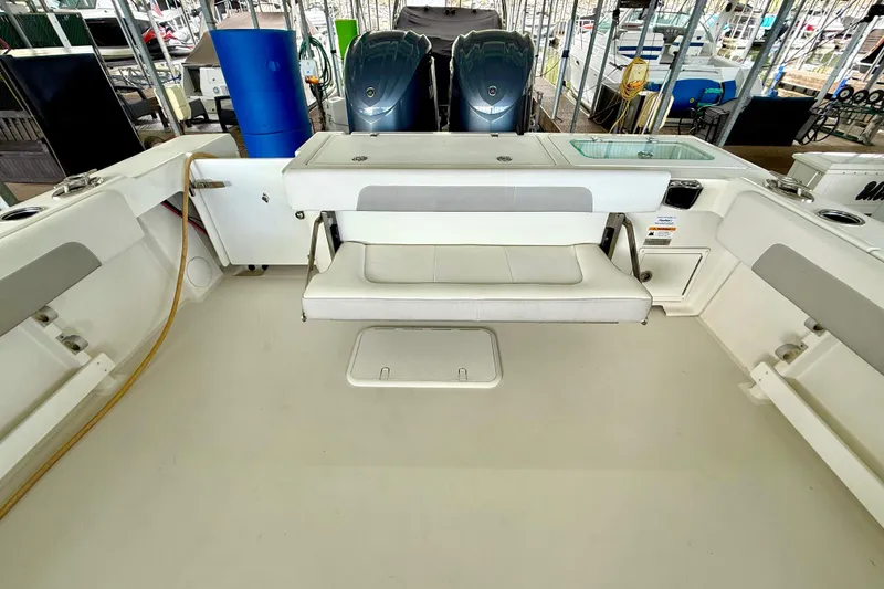 Slide: The Image of 2023 Parker 2820 XLD Sport Cabin boat interior with seating and storage. - 32