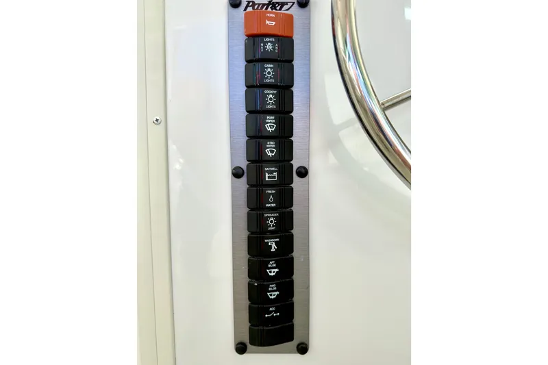 Slide: The Image of Control panel of 2023 Parker 2820 XLD Sport Cabin boat with labeled switches. - 46