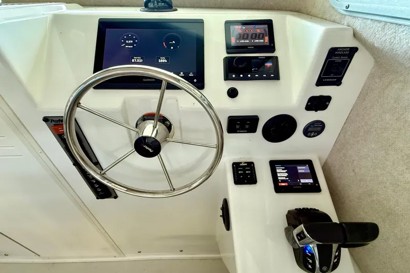 Slide: The Image of 2023 Parker 2820 XLD Sport Cabin dashboard with Garmin navigation and control systems. - 47
