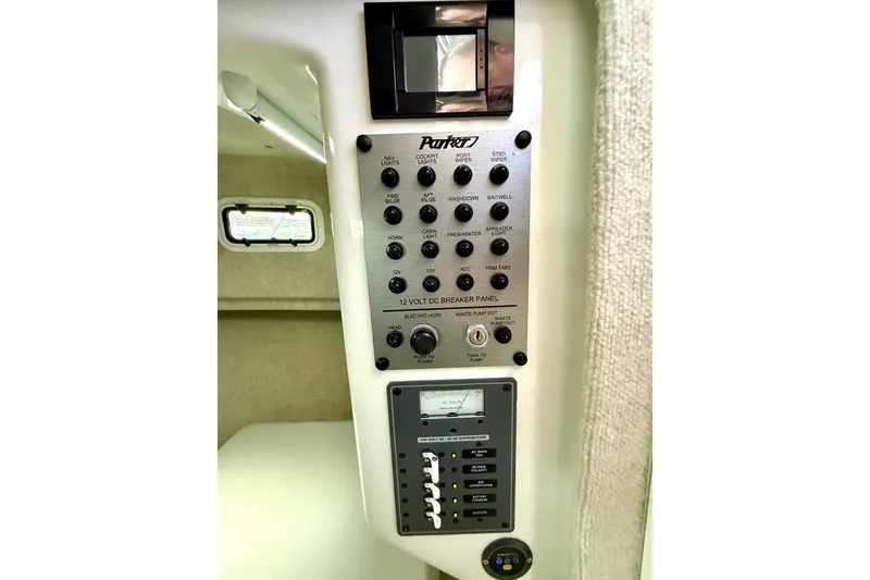 Slide: The Image of Control panel of 2023 Parker 2820 XLD Sport Cabin boat, featuring various switches and gauges. - 48