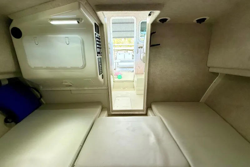 Slide: The Image of 2023 Parker 2820 XLD Sport Cabin interior with cushioned seating and storage. - 51