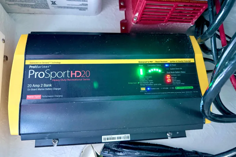 Slide: The Image of ProMariner ProSportHD20 marine battery charger in Parker 2820 XLD Sport Cabin, 2023 model. - 65