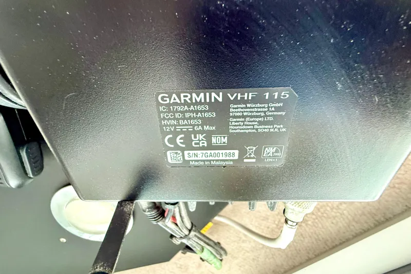Slide: The Image of Garmin VHF 115 radio label on Parker 2820 XLD Sport Cabin, 2023 model. - 66