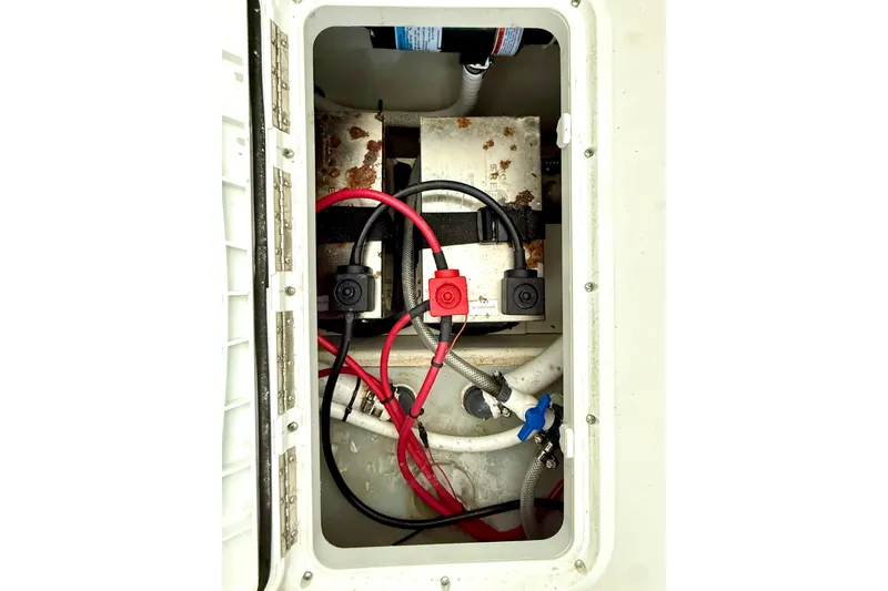 Slide: The Image of 2023 Parker 2820 XLD Sport Cabin boat wiring and battery compartment. - 68
