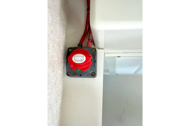 Slide: The Image of Red battery switch in 2023 Parker 2820 XLD Sport Cabin boat interior. - 73