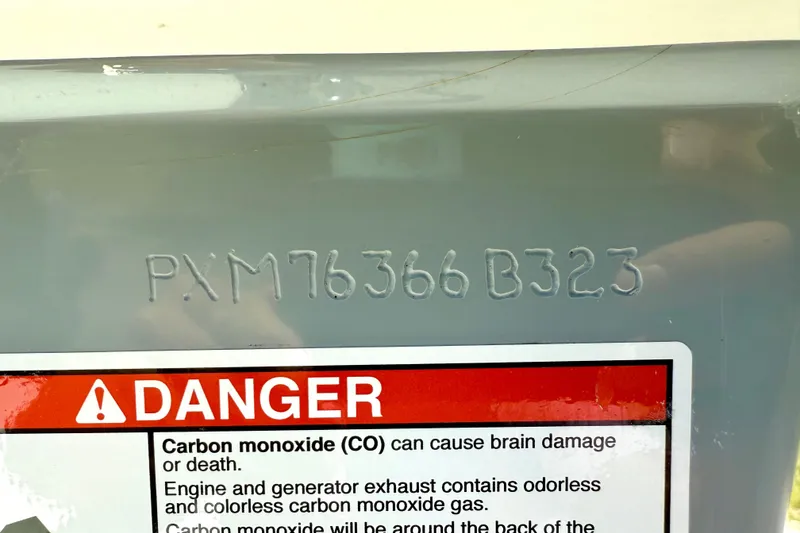 Slide: The Image of 2023 Parker 2820 XLD Sport Cabin with warning label and serial number. - 74