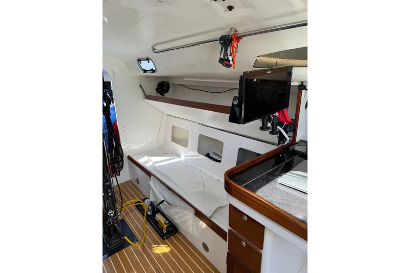 Slide: The Image of 2019 J Boats J/121 interior with modern navigation equipment and sleek wooden finishes. - 20
